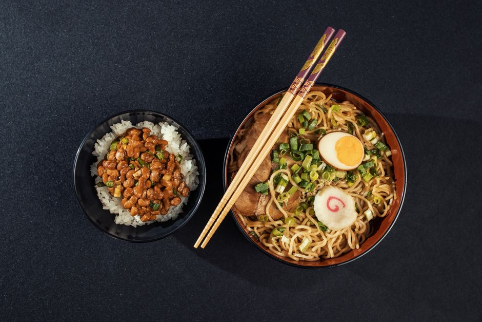 Top view of a Japanese ramen and natto rice bowl, perfect for culinary photography.